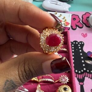 Vintage Gold Ring with Deep Red Gemstone and Clear Accents
